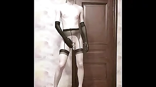 Crossdresser in a hutch confine fucks with a dildo and poses naked